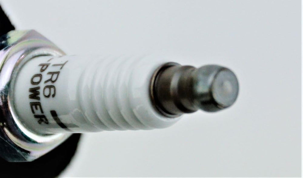 Close-up of NGK 4177 TR6 V-Power spark plug copper core detail