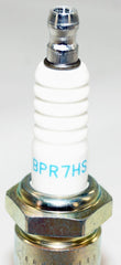NGK 6422x4 spark plugs close-up showing robust construction
