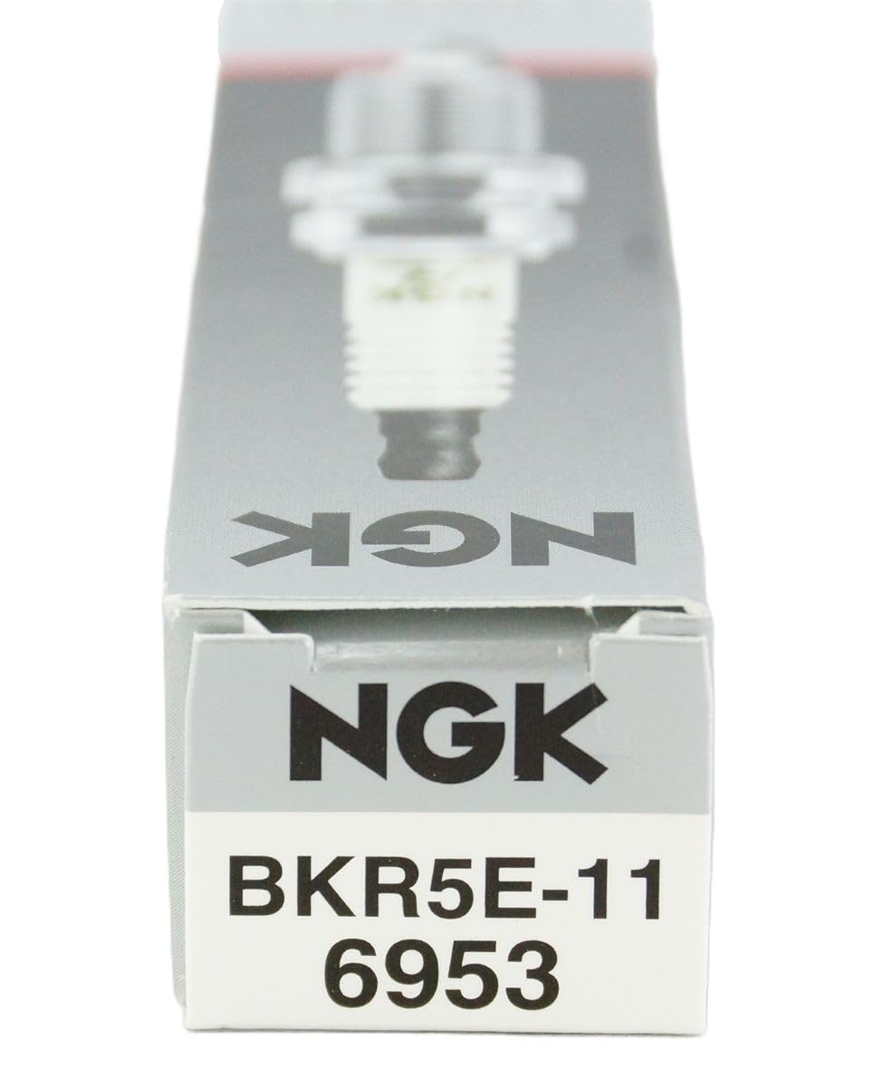 NGK 6953 spark plug BKR5E-11 in workshop set, ideal for professional maintenance.