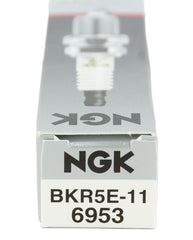 NGK 6953 spark plug BKR5E-11 in workshop set, ideal for professional maintenance.