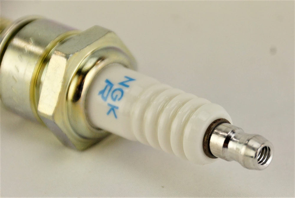NGK BPR6ES 7131 spark plug in engine bay shows OEM-fit