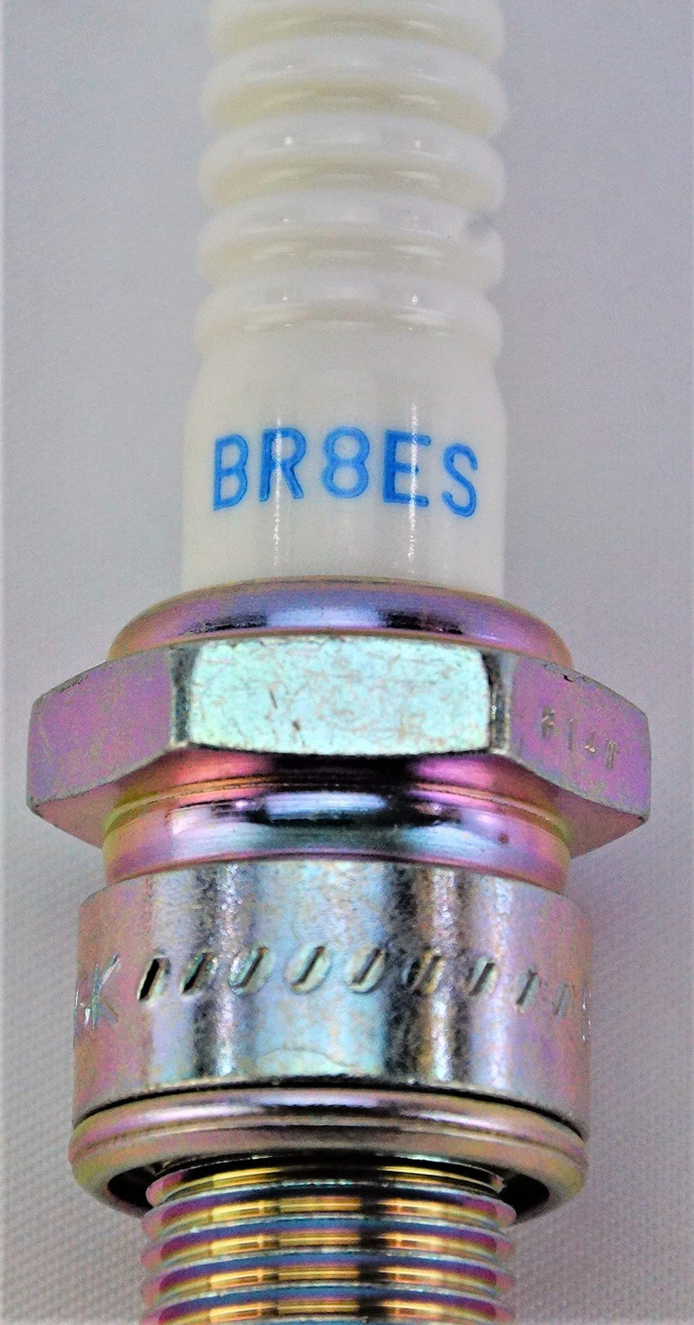NGK BR8ES spark plug thread and gap view helps confirm installation fit.