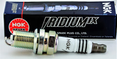 NGK brand image featuring four new spark plugs for installation readiness.