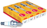 NGK CMR6H spark plug pack in yellow box indicating four-unit reliability