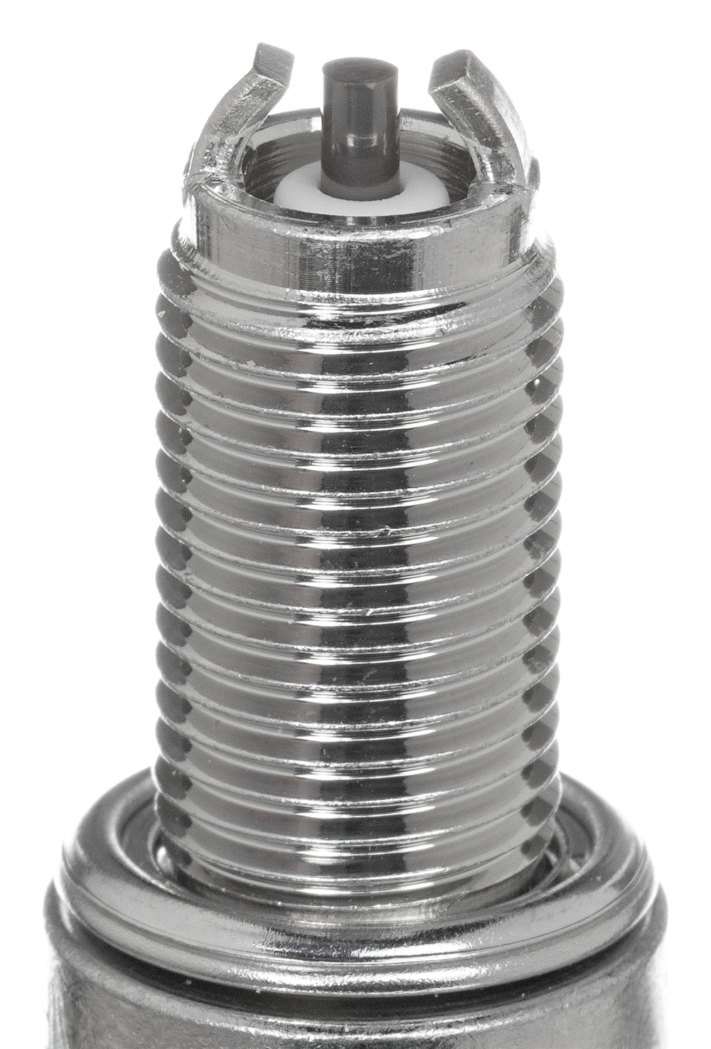 NGK CR9EK spark plug 4-pack closeup highlights resistance to carbon buildup for steady ignition.