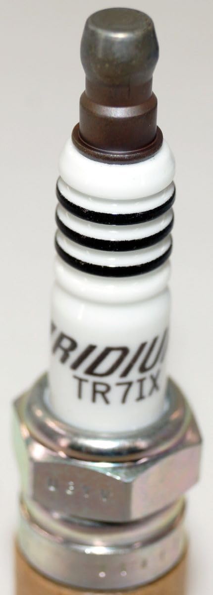 NGK Iridium IX spark plug in engine compartment for real-world use