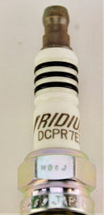 NGK spark plug electrode close-up, longevity emphasized