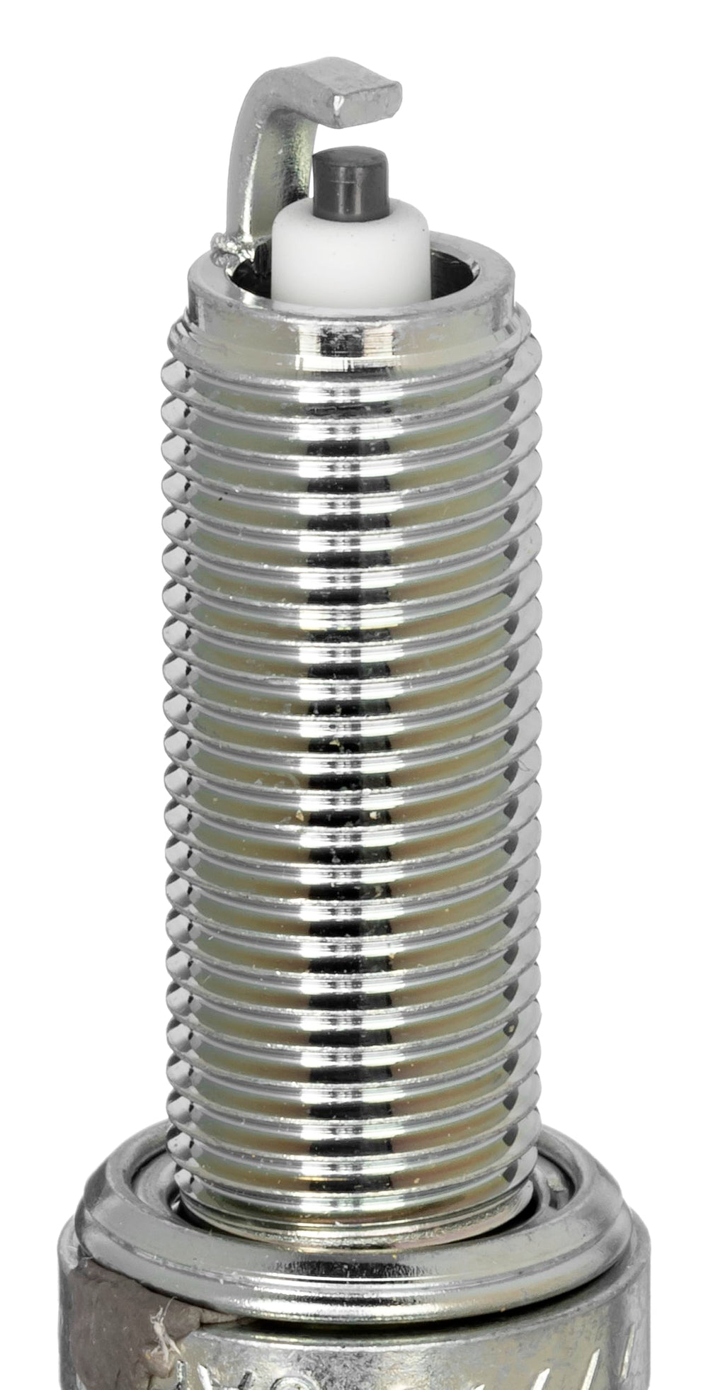 NGK LMAR7A-9 spark plug closeup shows corrugated insulator ribs for flashover prevention.