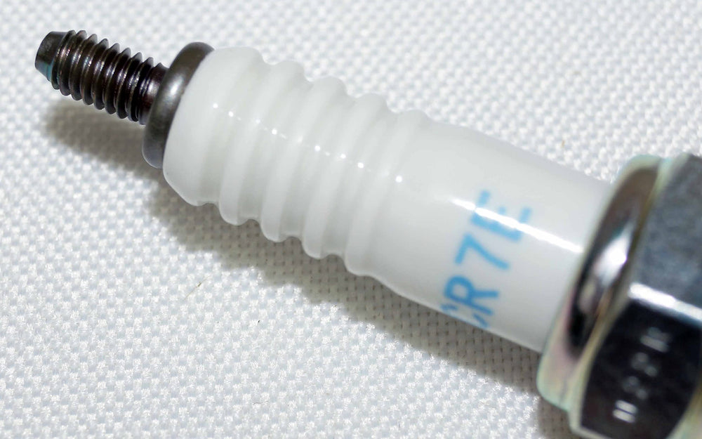 NGK spark plug finish close-up emphasizes corrosion-resistant shell.
