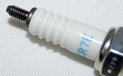 NGK spark plug finish close-up emphasizes corrosion-resistant shell.