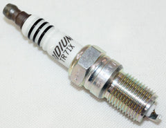 NGK spark plug installed in engine bay for smooth ignition potential