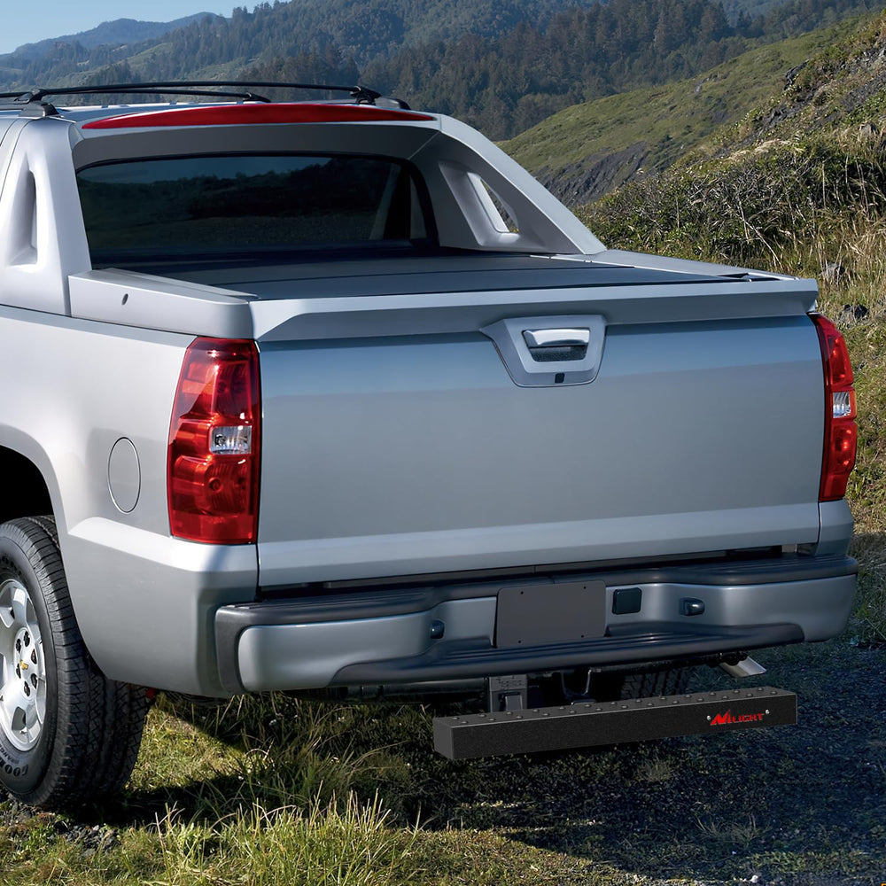 Nilight hitch step in use on a pickup truck for easier access