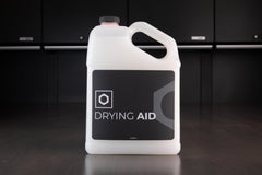 32 oz Obsessed Garage Drying Aid bottle beside wax and ceramic coating labels