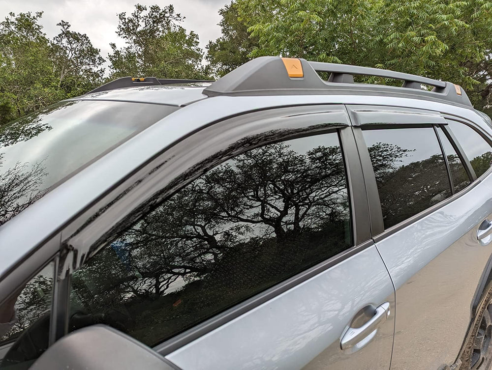 Olltoz Outback visor dark tint enhances glare reduction and sleek look on the window.