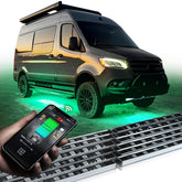 OPT7 Aura Pro RV underbody light bar illuminates campsite with vivid RGB colors.