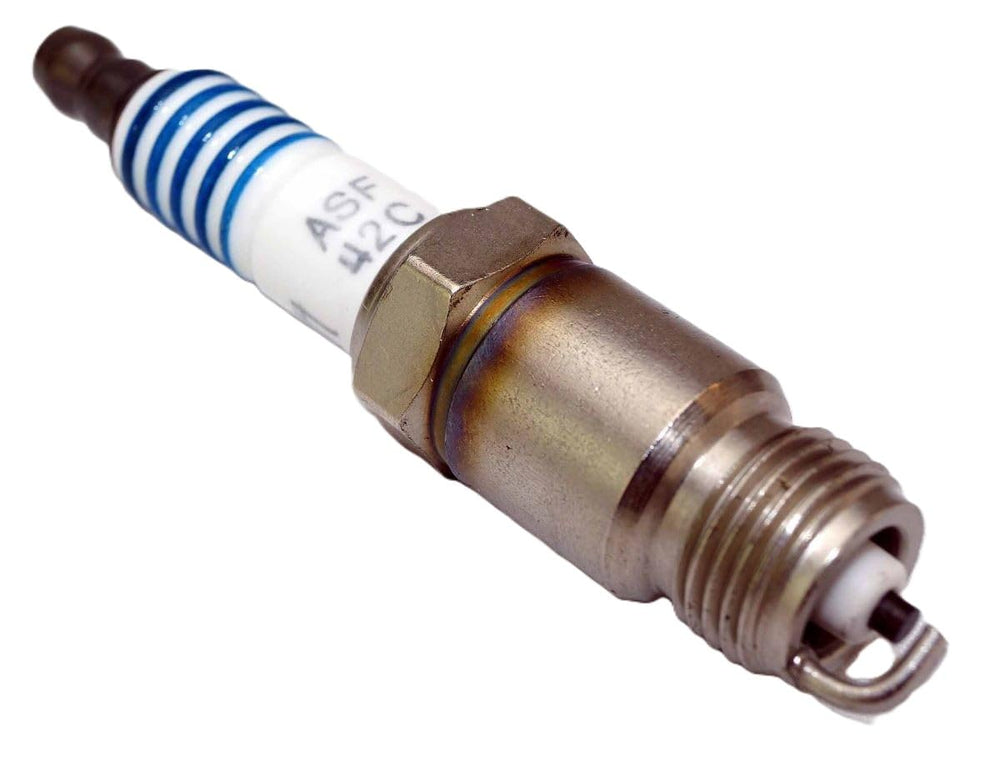 Spark plugs arranged for quick comparison and installation readiness