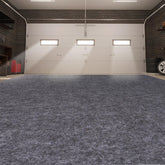Pandoroom garage mats under car showing oversized protection against spills.