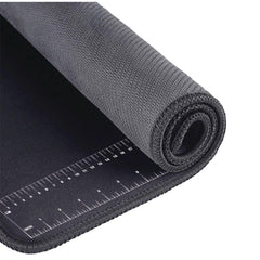 Chemical-resistant surface of Performance Tool neoprene mat protecting the workspace