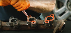 Permatex Ultra Red sensor-safe formulation shown in a clean automotive application.