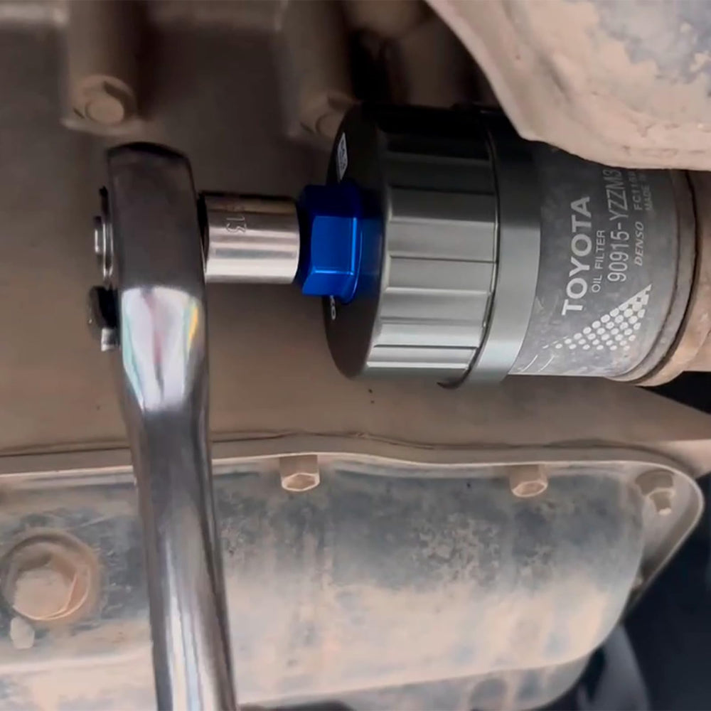 PESIKO wrench in use during an oil change scenario.