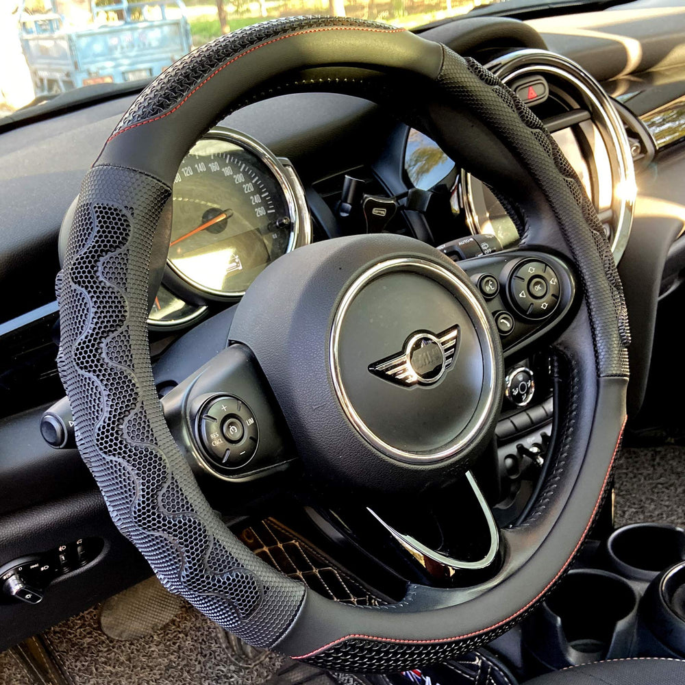 PINCTROT steering wheel cover with great grip and 3D honeycomb texture for secure handling.