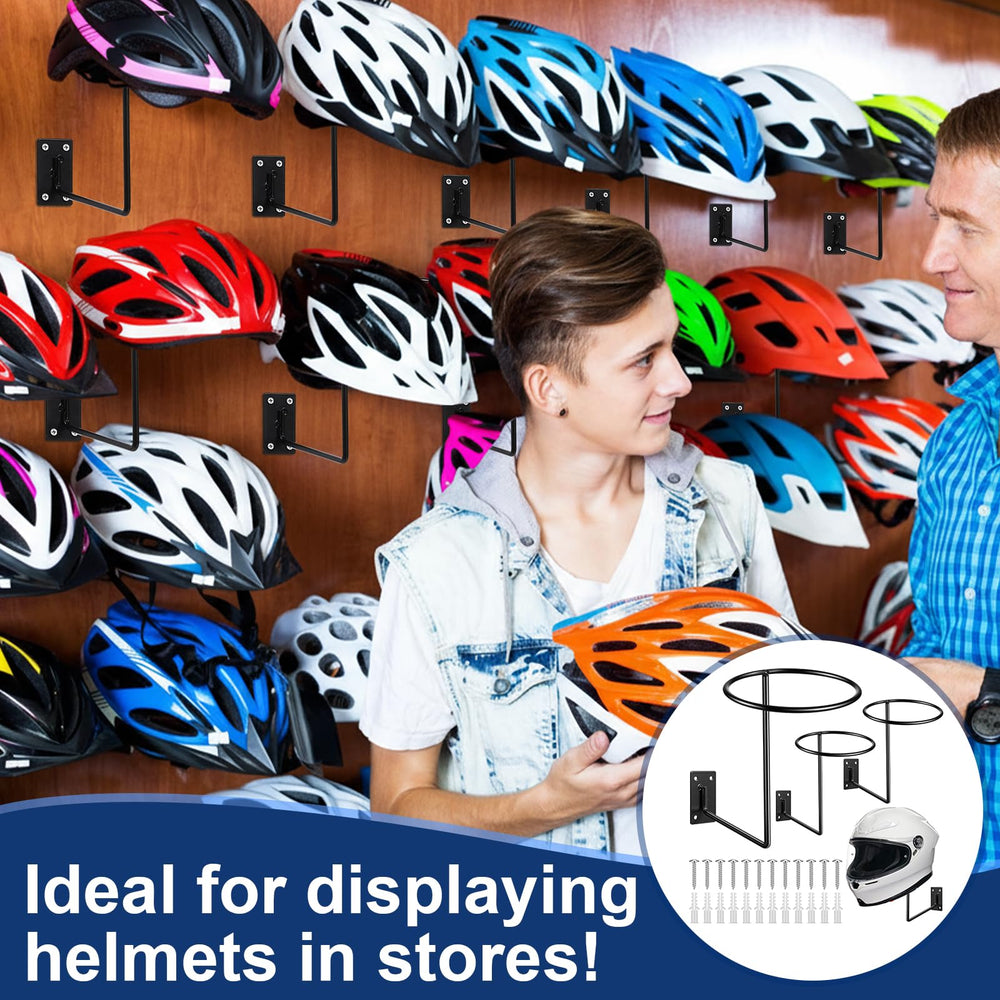 Potchen black metal wall mount keeps helmets off the floor and within reach.