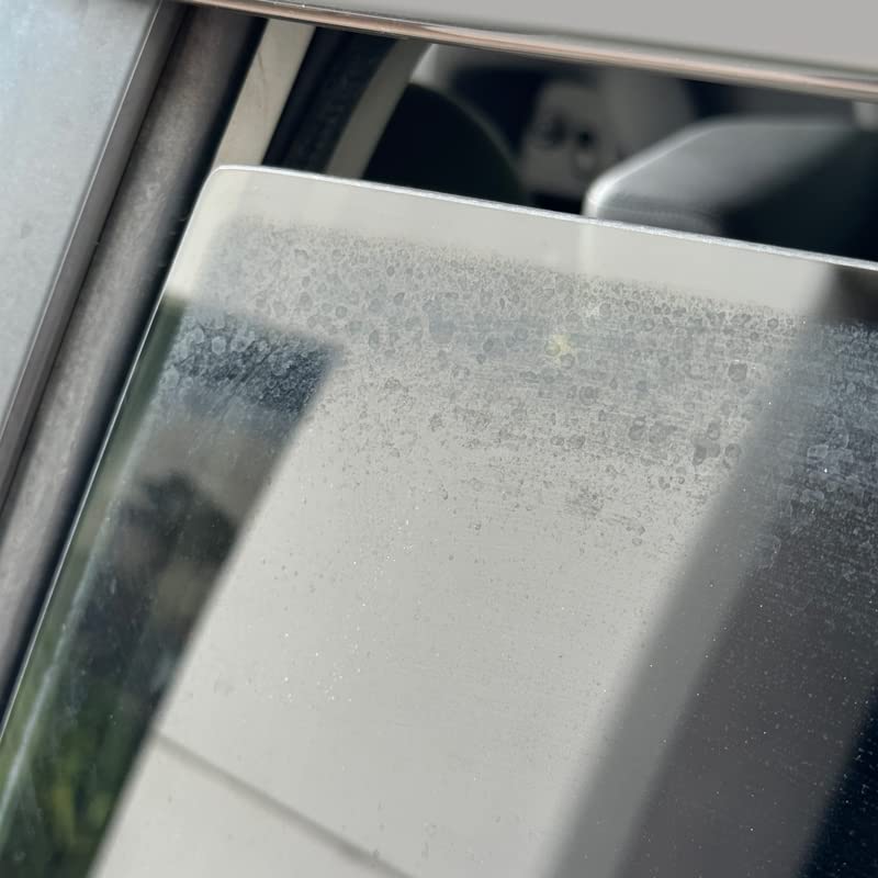 PROJE' Water Spot Remover on glass surface removing stubborn stains.