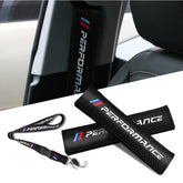 QOMAGO Car M seat belt cover with carbon fiber texture enhances interior style and comfort.