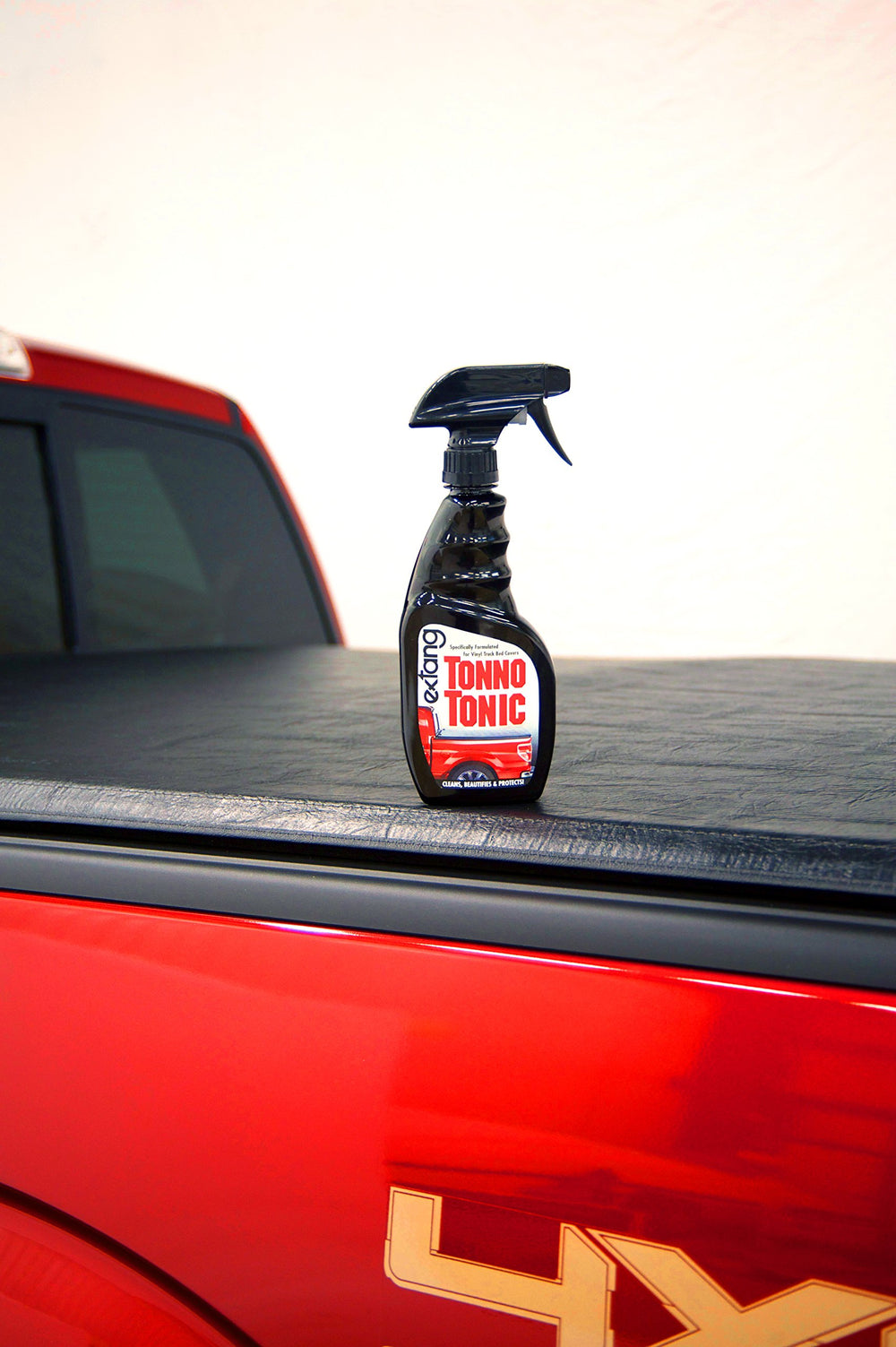 RealTruck Extang Tonno Tonic application wipe demonstrates easy, even cleaning for weathered tonneau covers.