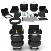 RETRUE rear air bags suspension kit mounted on a Silverado/Sierra for load leveling.