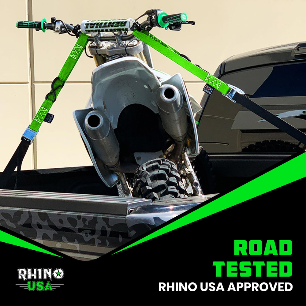 Rhino USA green two-pack tiedowns, ready for rugged outdoor motorcycle transport.