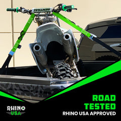 Rhino USA green two-pack tiedowns, ready for rugged outdoor motorcycle transport.