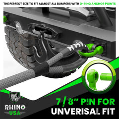 Rhino USA shackles in action for off-road recovery on rough terrain.