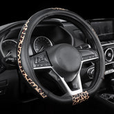 Road Comforts D-Type leopard front view steering wheel cover enhances grip and style.