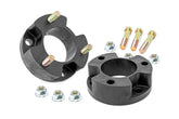 Rough Country 2.5-inch leveling kit front strut spacers boost ground clearance.