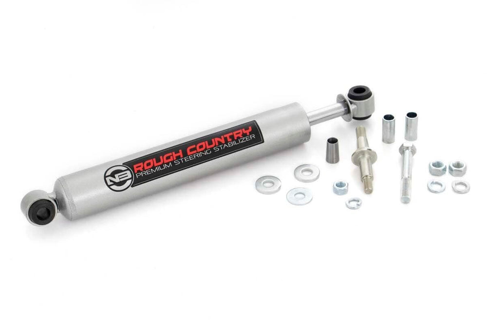 Rough Country N3 steering stabilizer on a Ram 2500/3500, side view, enhancing stability on rough roads.
