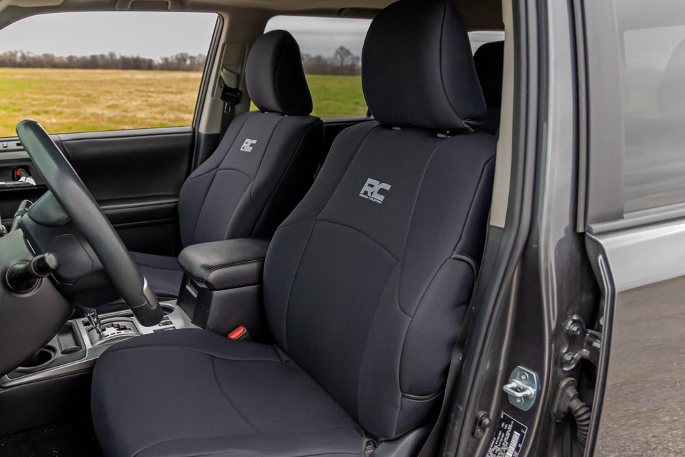 Rough Country neoprene seat cover installation close-up highlights secure fit