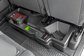 Rough Country under-seat storage in Ram 1500 Crew Cab, side view showing compact integration.