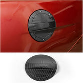 RT-TCZ carbon fiber fuel filler door for Mustang closeup showing textured grain and finish.