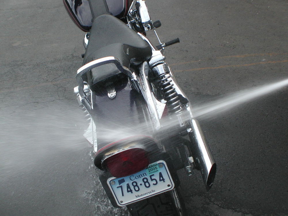 S100 Total Cycle Cleaner applied to engine bay for grime removal.
