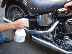 S100 Total Cycle Cleaner in action on motorcycle bodywork.