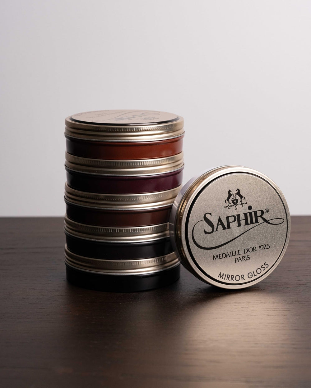 SAPHIR Medaille d’Or dark brown boots receiving brilliant mirror gloss.