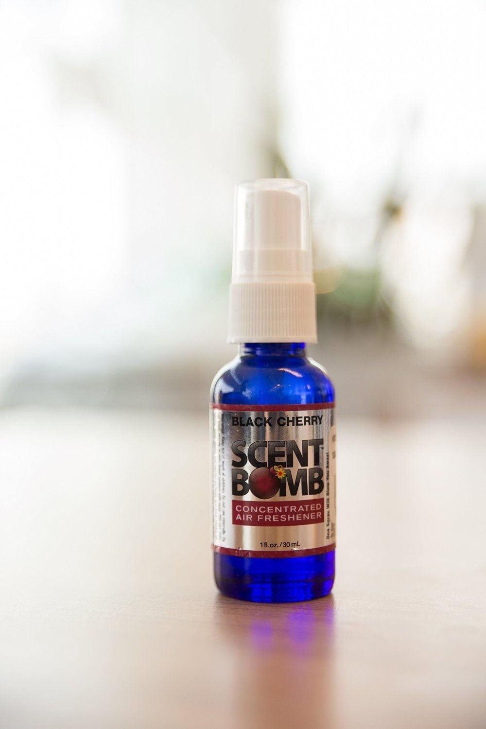 Scent Bomb Black Cherry spray in a room setting freshens spaces.
