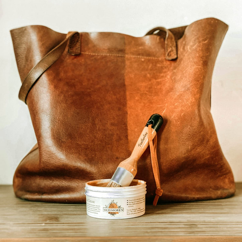 Skidmore's Leather Cream application with brush delivers deep penetration for lasting softness.