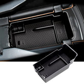 SKTU Envision console organizer with coins and sunglasses keeps essentials within reach.
