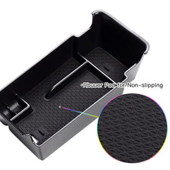 SKTU Envision console organizer shows divided storage for coins, cards, and small items.