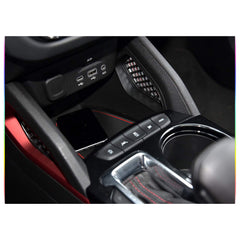 SKTU Trailblazer armrest storage mat in red helps prevent clutter.