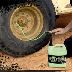 Slime sealant being applied to an off-road tire