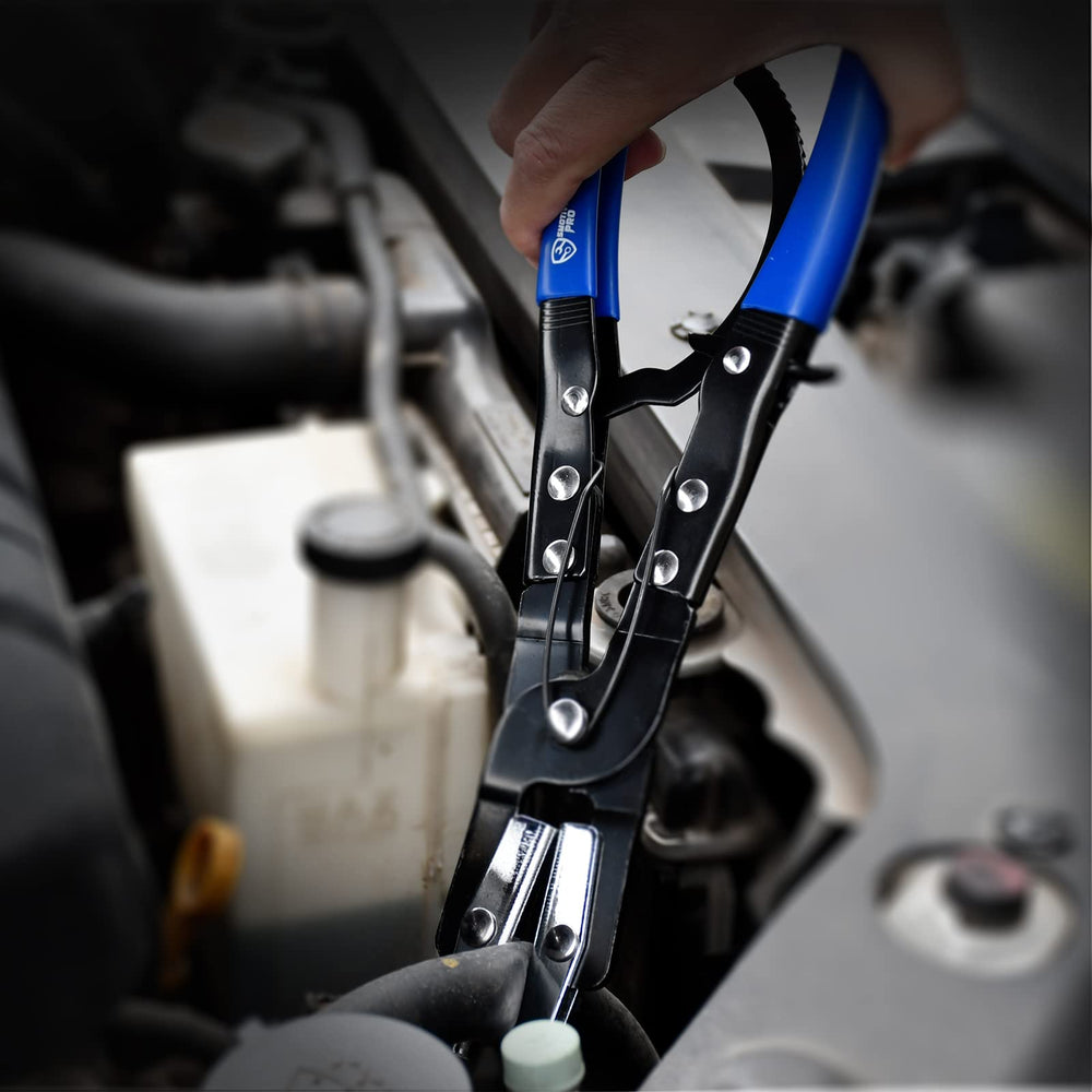SMOTIVEPRO pliers in engine compartment help seal hoses safely.