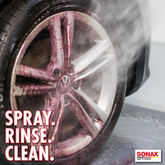 Sonax Wheel Cleaner Plus spray action on wheels shows safe, non-acid cleaning power.